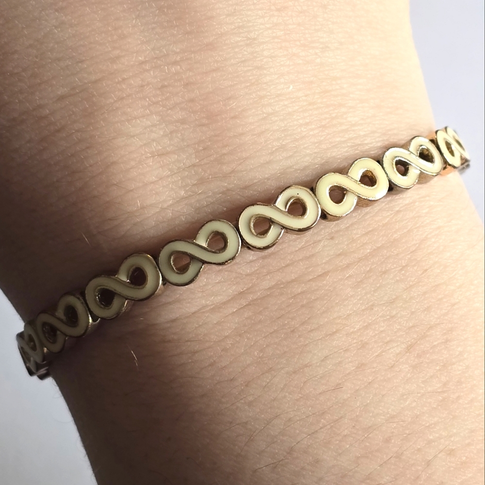 Infinity symbol bracelet stretch cream ivory colored enamel gold tone